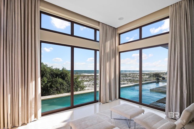 7276 Kiva Way, Gulf Shores, AL 36542 - bedroom featuring access to exterior, a water view, and a towering ceiling