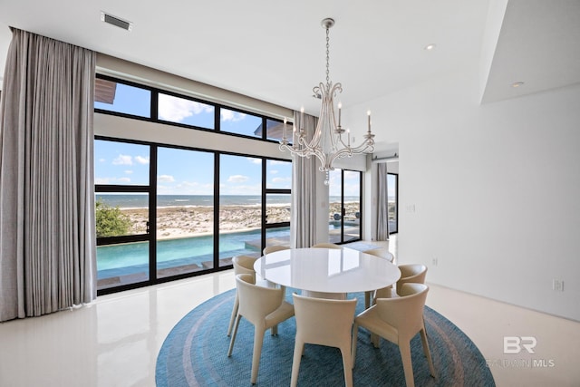 7276 Kiva Way, Gulf Shores, AL 36542 - dining area featuring a chandelier and a water view