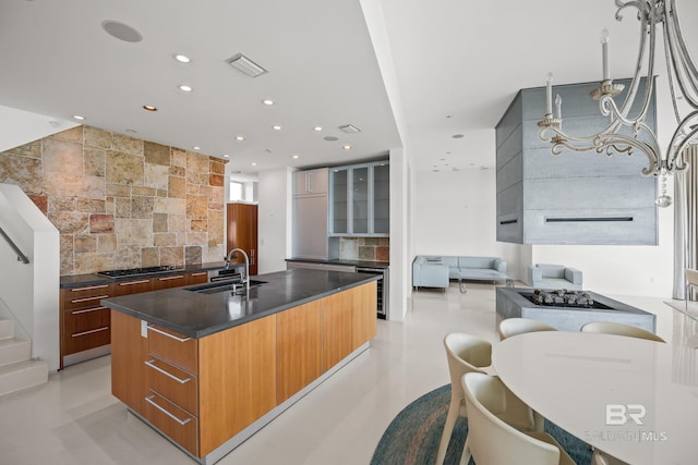 7276 Kiva Way, Gulf Shores, AL 36542 - kitchen featuring a sink, modern cabinets, tasteful backsplash, dark countertops, and recessed lighting