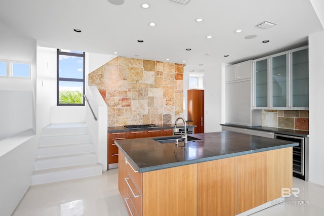 7276 Kiva Way, Gulf Shores, AL 36542 - kitchen featuring a sink, beverage cooler, dark countertops, tasteful backsplash, and recessed lighting