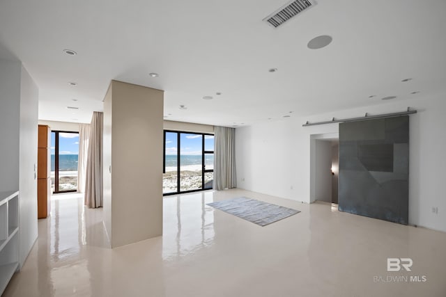 7276 Kiva Way, Gulf Shores, AL 36542 - empty room with healthy amount of natural light and a barn door