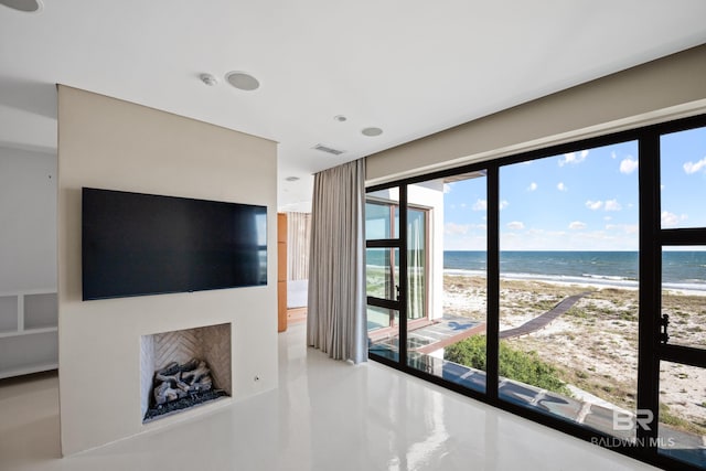 7276 Kiva Way, Gulf Shores, AL 36542 - unfurnished living room featuring view of water and beach