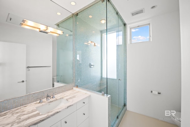 7276 Kiva Way, Gulf Shores, AL 36542 - bathroom with a stall shower, toilet, recessed lighting, and vanity