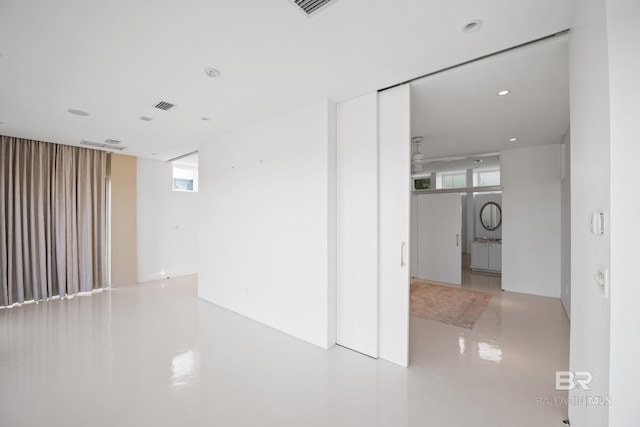 7276 Kiva Way, Gulf Shores, AL 36542 - spare room with healthy amount of natural light and recessed lighting