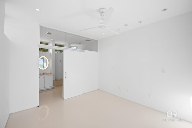 7276 Kiva Way, Gulf Shores, AL 36542 - spare room with ceiling fan, recessed lighting, and concrete floors