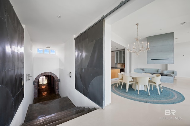 7276 Kiva Way, Gulf Shores, AL 36542 - hallway with a chandelier