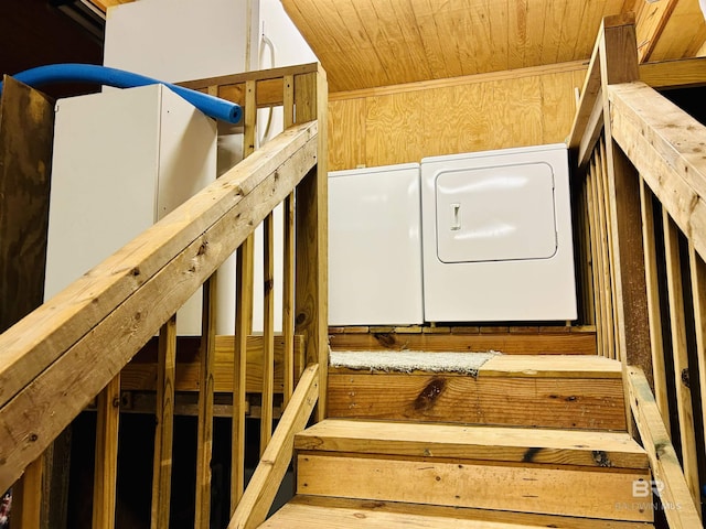 washroom featuring washer / dryer and wood ceiling