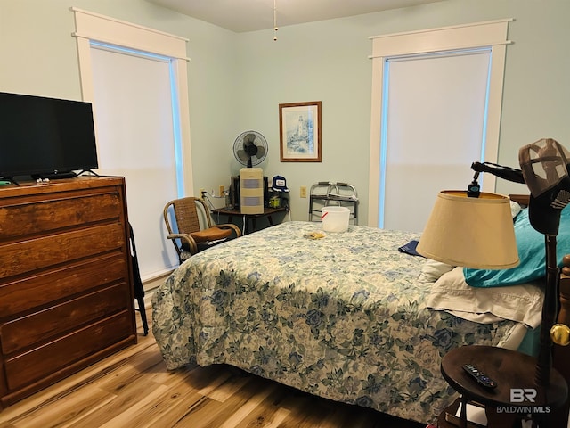 bedroom featuring wood finished floors