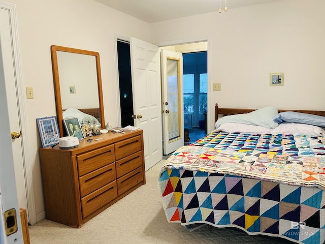 bedroom featuring light colored carpet