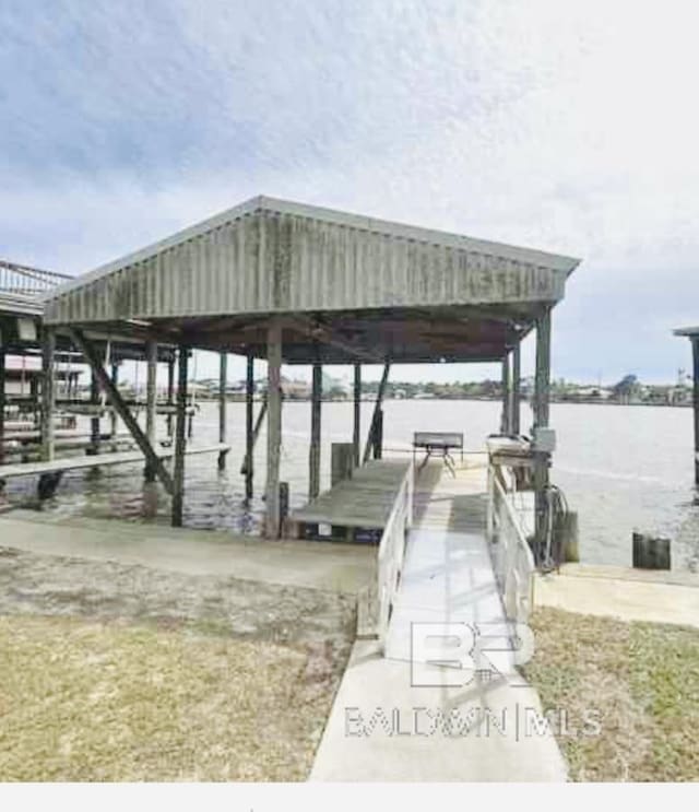 dock area featuring a water view