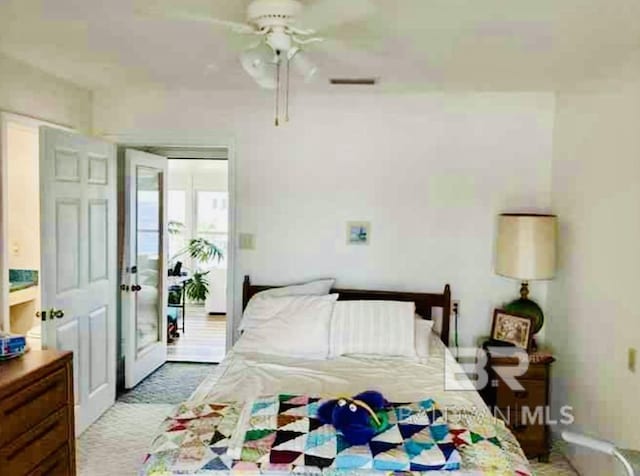 bedroom with a ceiling fan and baseboards
