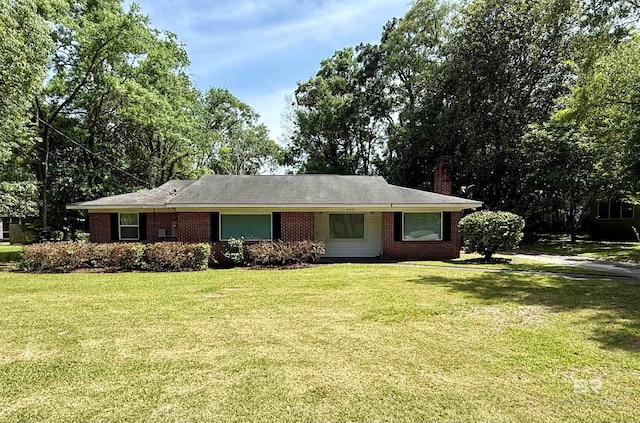 403 Sutherland Dr, Chickasaw, AL 36611 - ranch-style home with a front yard, brick siding, and a chimney