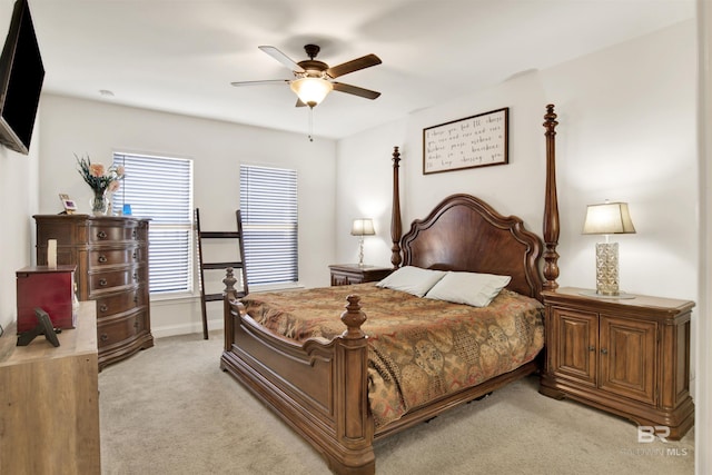 bedroom featuring ceiling fan and light colored carpet