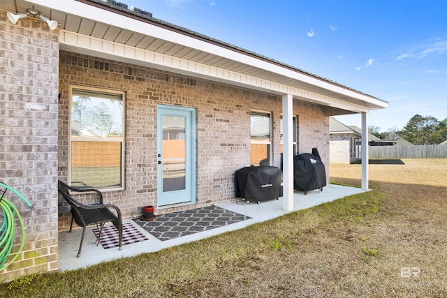 back of house featuring a lawn and a patio