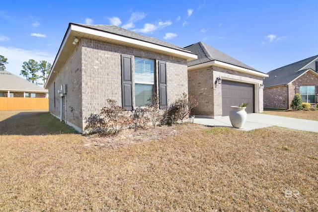 view of front of property with a front lawn and a garage