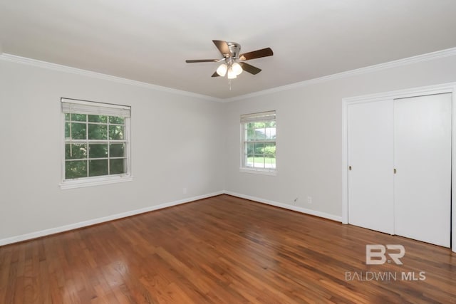 2105 Upham Pl, Mobile, AL 36607 - unfurnished bedroom featuring ornamental molding, wood finished floors, baseboards, a closet, and ceiling fan