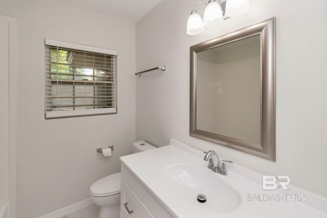 2105 Upham Pl, Mobile, AL 36607 - bathroom with toilet, vanity, and baseboards