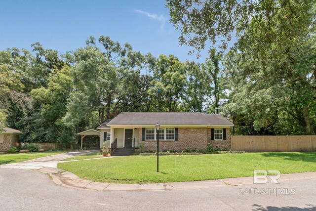 2105 Upham Pl, Mobile, AL 36607 - view of front facade featuring concrete driveway, brick siding, and an attached carport