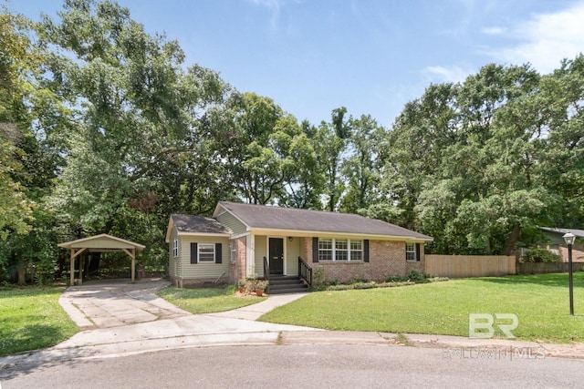 2105 Upham Pl, Mobile, AL 36607 - view of front facade featuring concrete driveway, brick siding, and a carport