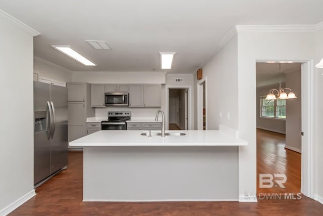 2105 Upham Pl, Mobile, AL 36607 - kitchen with stainless steel appliances, gray cabinetry, a sink, a chandelier, and crown molding