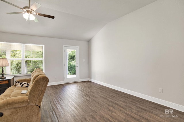 22894 Ridgewood Dr, Robertsdale, AL 36567 - living room with vaulted ceiling, dark wood finished floors, baseboards, and a ceiling fan