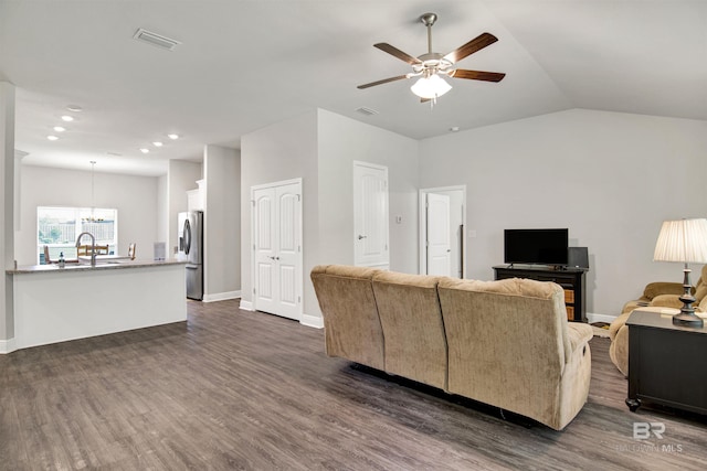 22894 Ridgewood Dr, Robertsdale, AL 36567 - living room with ceiling fan, dark wood-type flooring, a chandelier, recessed lighting, and baseboards