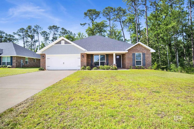 22894 Ridgewood Dr, Robertsdale, AL 36567 - view of front of house featuring brick siding, driveway, an attached garage, a front lawn, and board and batten siding