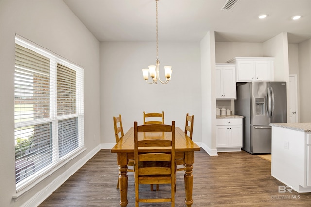 22894 Ridgewood Dr, Robertsdale, AL 36567 - dining area featuring plenty of natural light, a chandelier, dark wood finished floors, recessed lighting, and baseboards