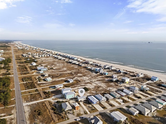 birds eye view of property featuring a water view and a view of the beach