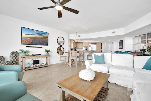 tiled living room featuring ceiling fan