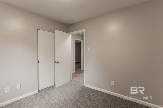 unfurnished bedroom featuring carpet floors