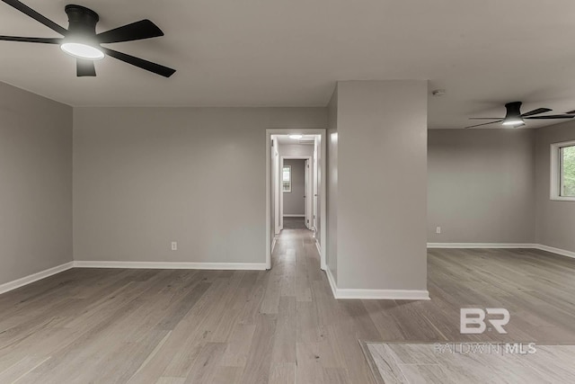 spare room featuring ceiling fan and light wood-type flooring