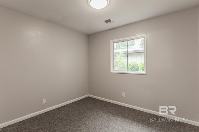 empty room featuring carpet flooring