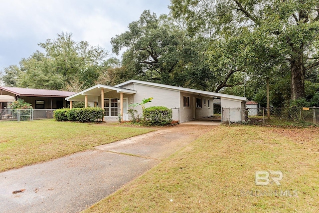 view of front facade with a front lawn and a carport