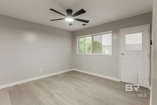 unfurnished room featuring ceiling fan and light hardwood / wood-style floors