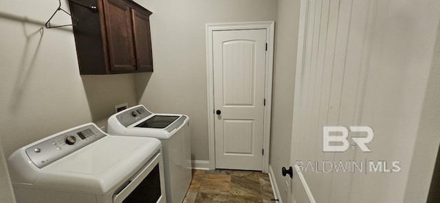 laundry area featuring tile patterned flooring, cabinets, and independent washer and dryer