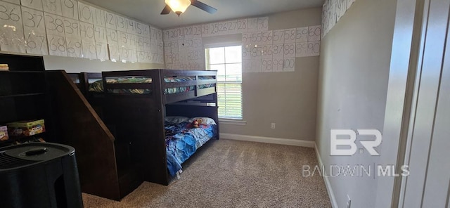 bedroom with ceiling fan and carpet flooring