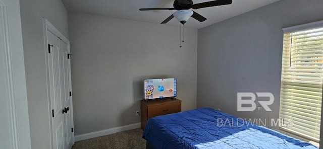 carpeted bedroom featuring ceiling fan