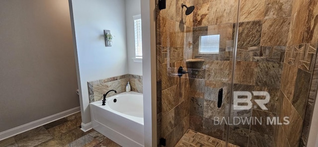 bathroom featuring tile patterned flooring and shower with separate bathtub