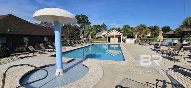 view of swimming pool featuring a patio area