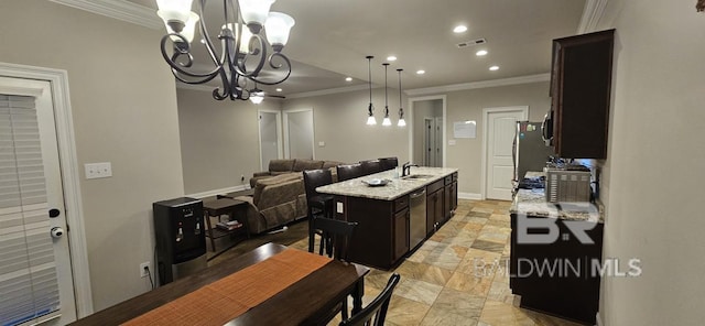 kitchen featuring light stone countertops, sink, an inviting chandelier, a center island with sink, and light tile patterned flooring