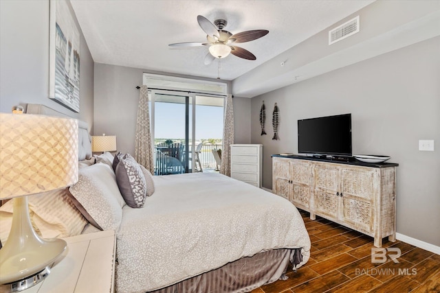 bedroom with visible vents, baseboards, ceiling fan, access to exterior, and wood tiled floor