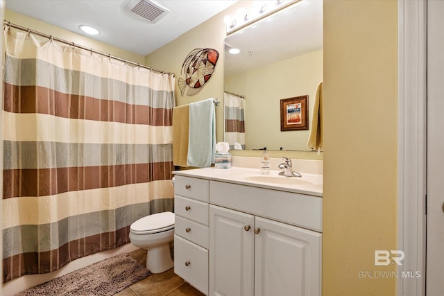 full bathroom with visible vents, a shower with shower curtain, toilet, tile patterned floors, and vanity