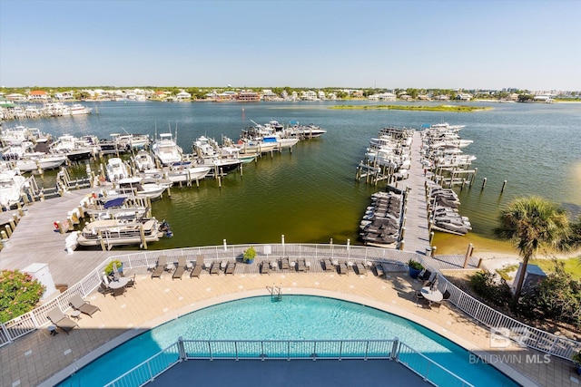 birds eye view of property with a water view