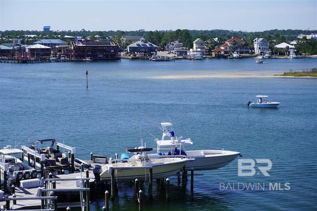 dock area with a water view and boat lift