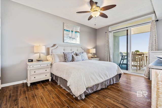 bedroom with baseboards, dark wood finished floors, a ceiling fan, and access to exterior