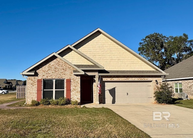 view of front of house with a garage and a front yard