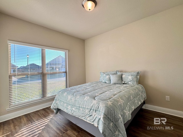 bedroom featuring dark hardwood / wood-style floors