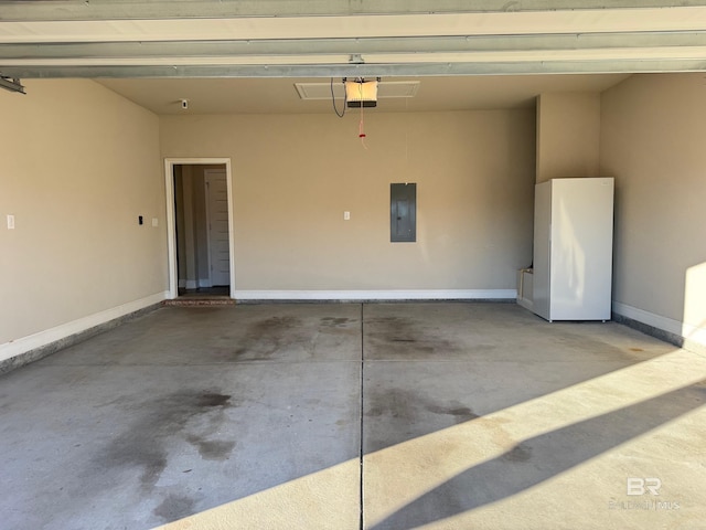 garage with electric panel, white fridge, and a garage door opener