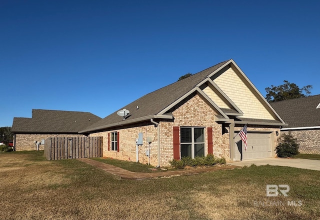 view of side of property featuring a garage and a lawn